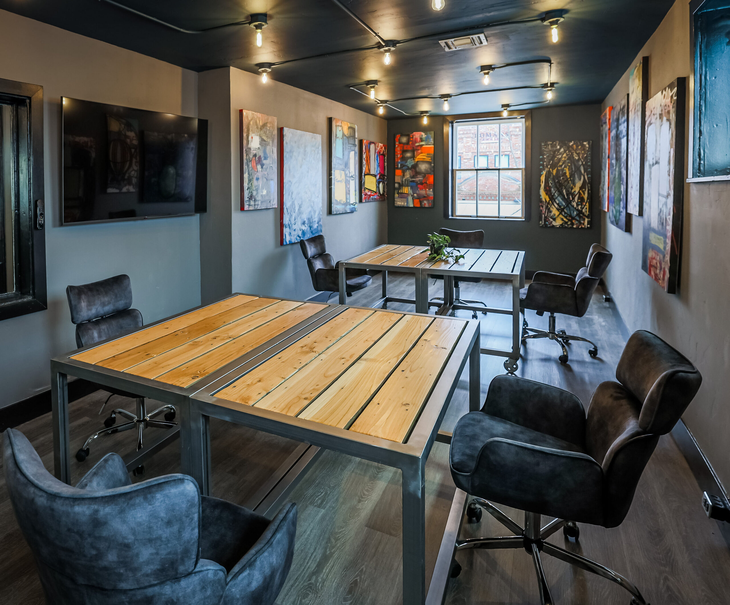 The Loft private office at Granite City Workspaces, showing a polished founder-friendly workspace used for pre-dinner prep, presentations, and executive conversations